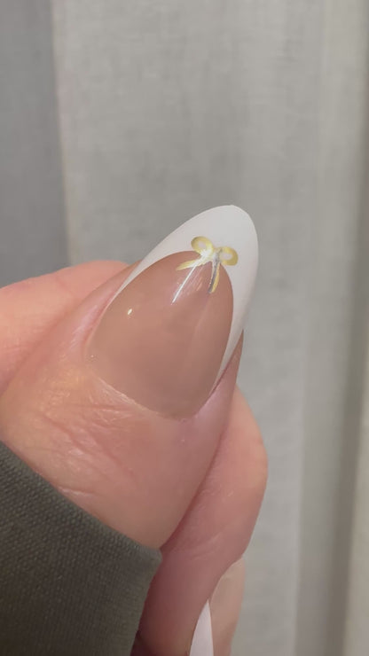 French Elegance - Gold Bow French Tip Almond Nails